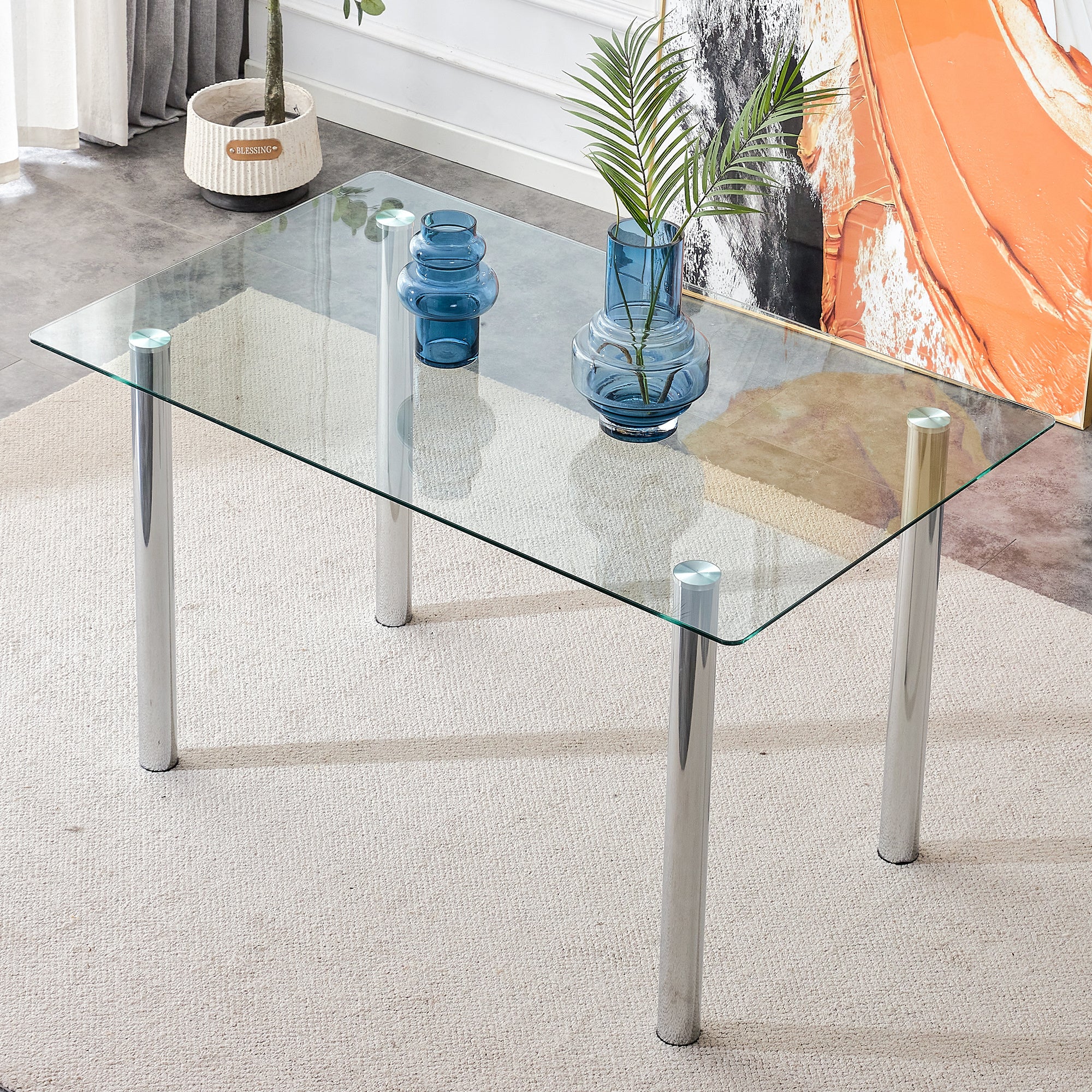 Modern minimalist glass dining table. A transparent tempered glass desktop with a thickness of 0.3 feet and metal legs. Suitable for restaurants and living rooms. 51"*31.4"*29.5"