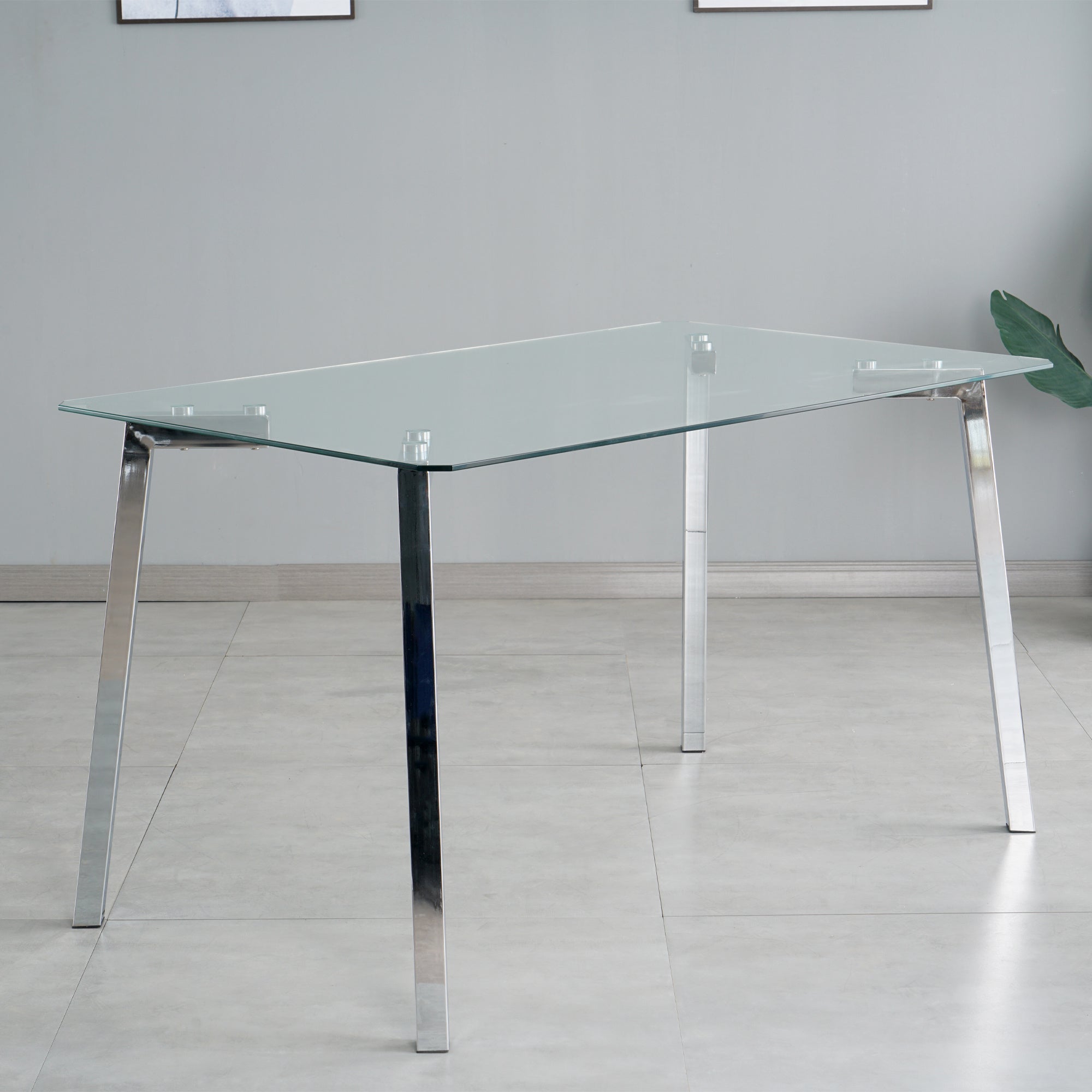 Modern minimalist rectangle glass dining table, transparent glass tabletop and electroplate metal legs, suitable for kitchens, restaurants, and living rooms