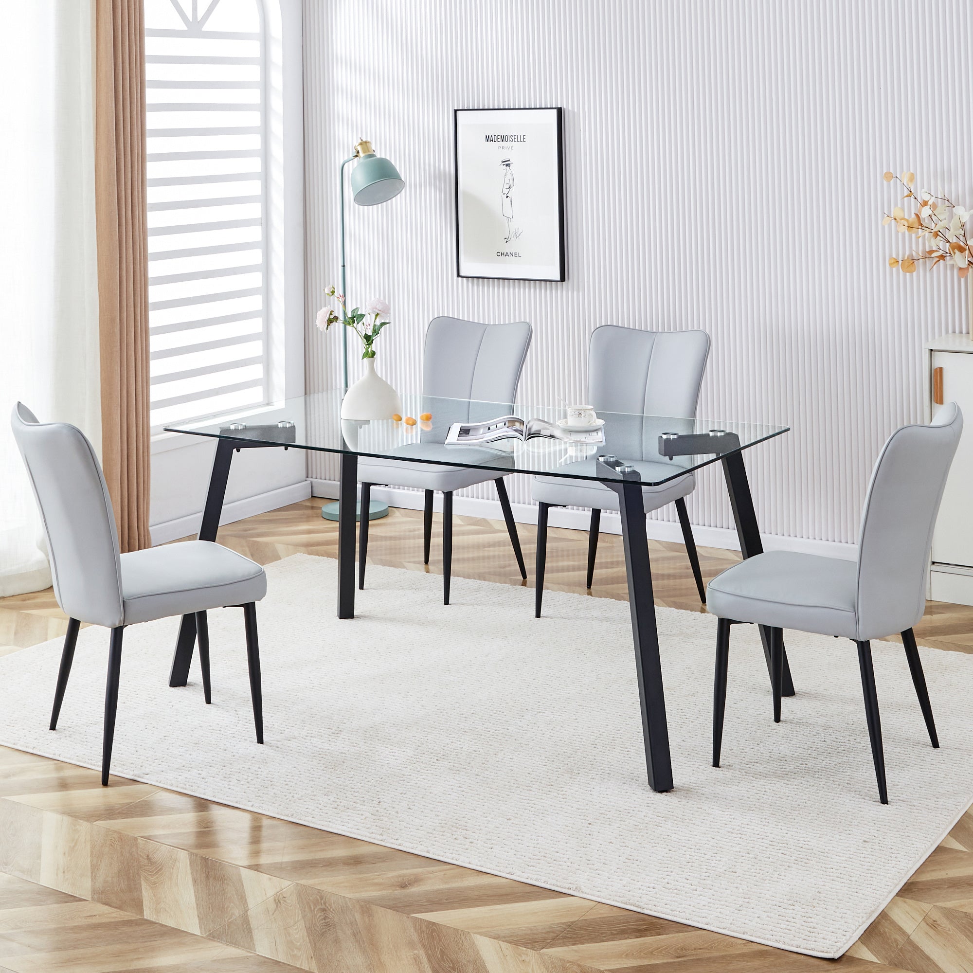 Table and chair set. 1 table and 4 light grey chairs. Glass dining table with 0.31-inch tempered glass tabletop and black coated metal legs. Equipped with light grey PU chairs 1123 008