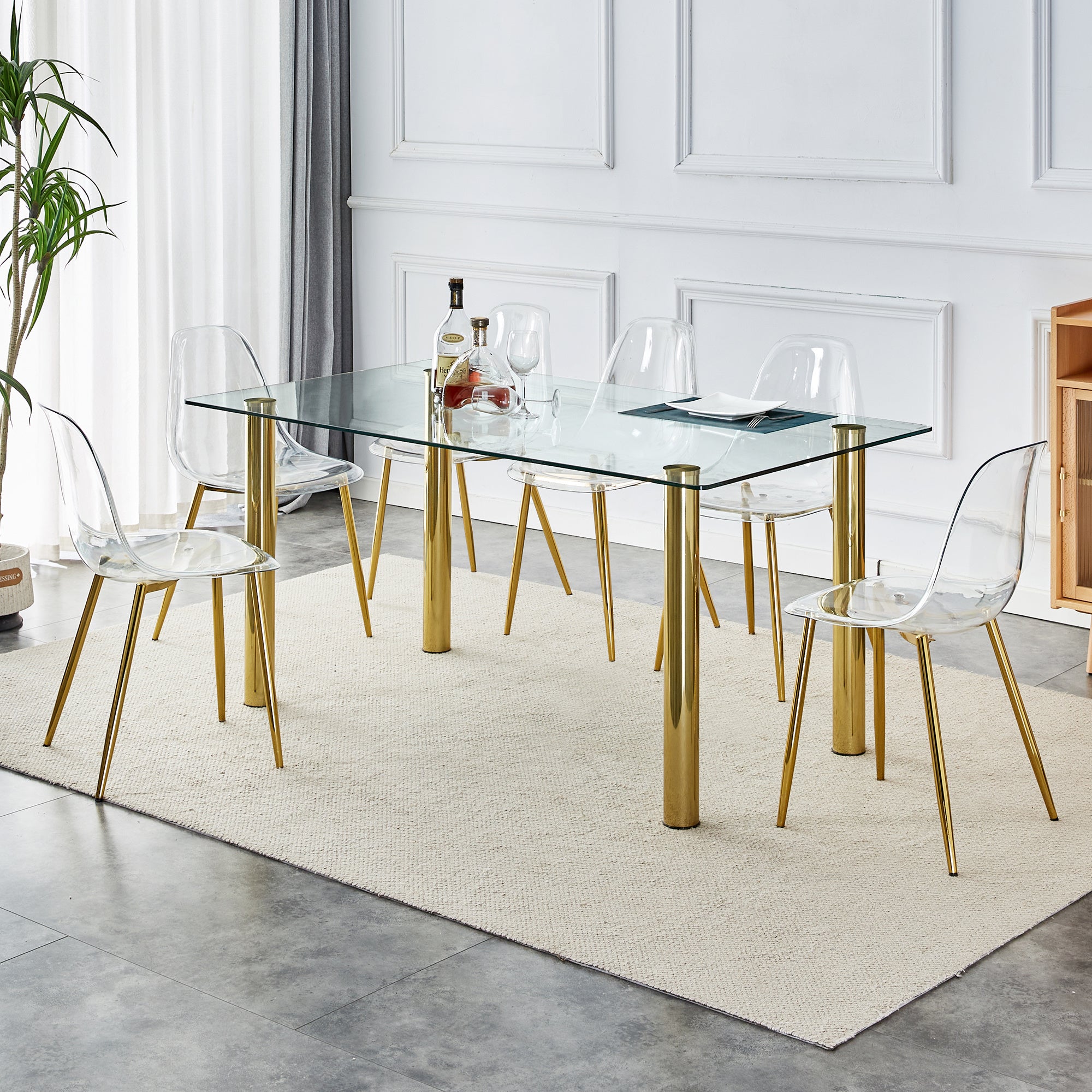 1 table with 6 chairs, transparent tempered glass tabletop, thickness of 0.3 feet, golden metal legs, paired with plastic armless crystal chair, gold-plated metal legs. T-003 TW-1200