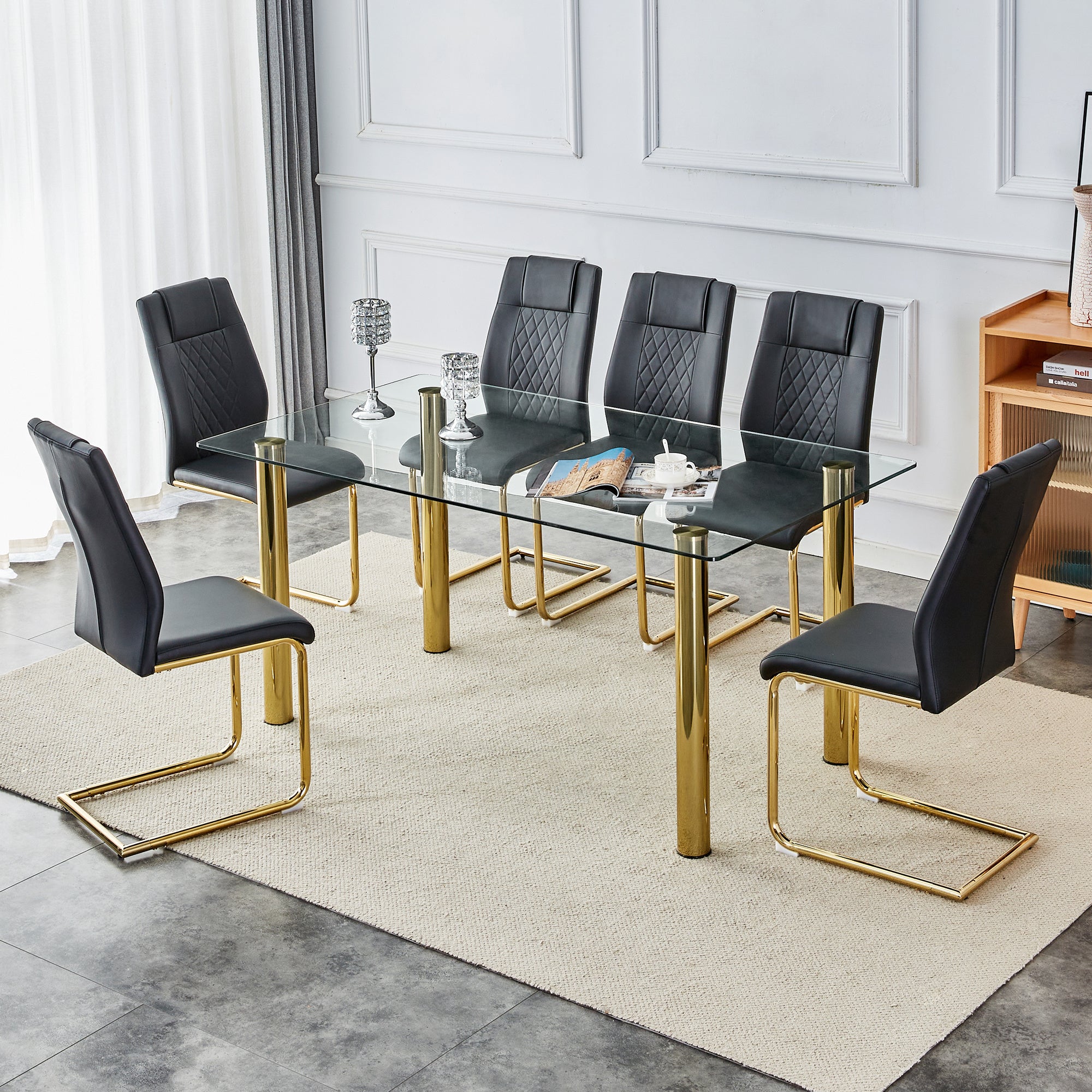 Table and chair set, 1 table with 6 black chairs. Transparent tempered glass tabletop with a thickness of 0.3 feet and golden metal legs. Paired with PU black seat cushions and gold leg chair