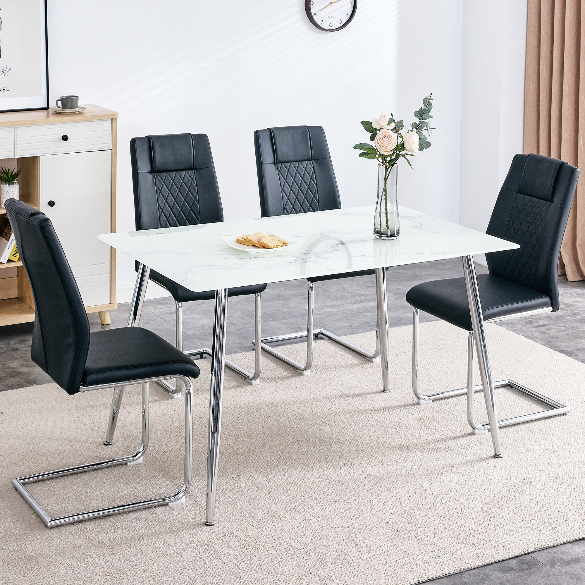Table and chair set. 1 table with 4 black PU chairs. Modern minimalist rectangular white imitation marble dining table, with silver metal legs. Paired with 4 chairs with silver legs.DT-1544 c001