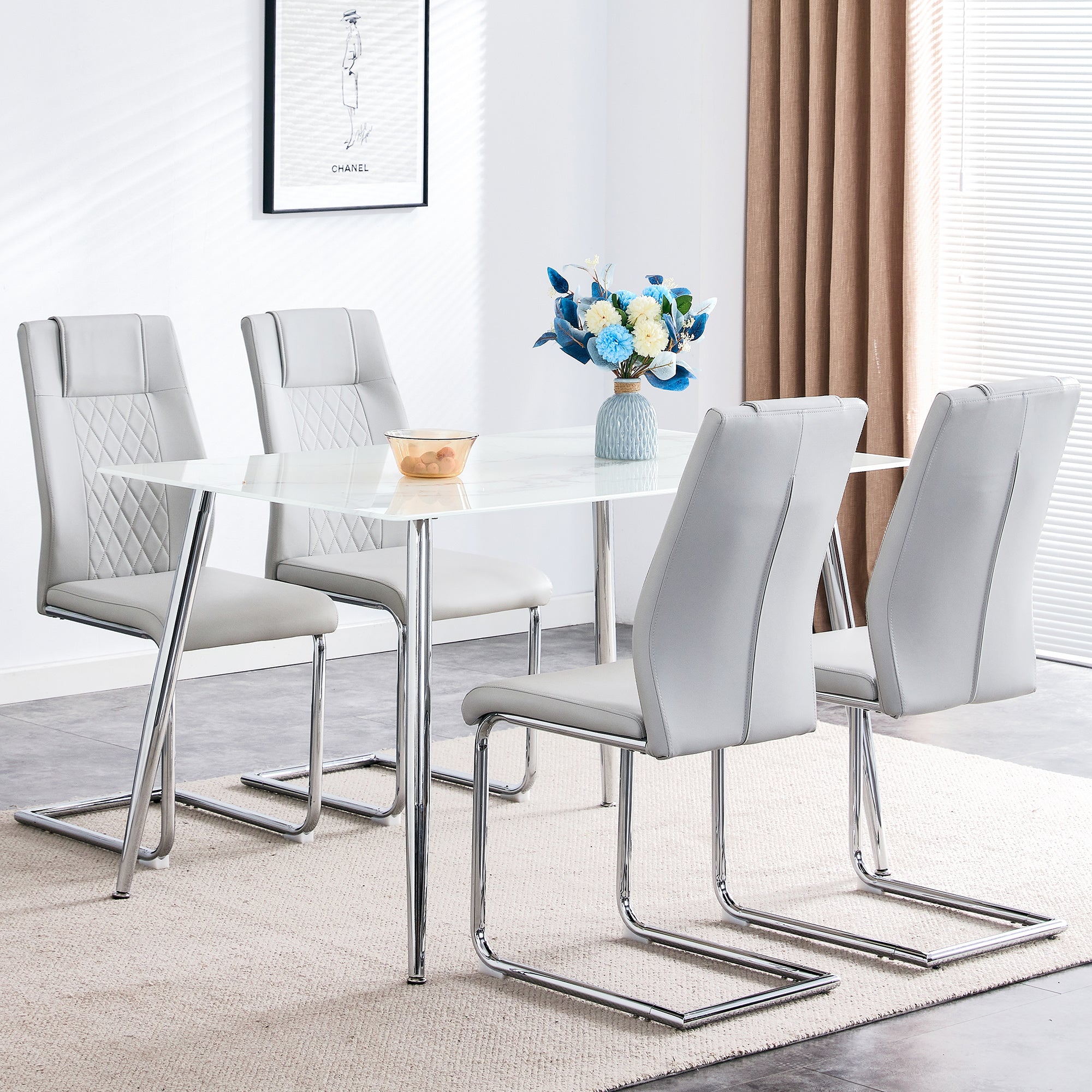 Table and chair set. 1 table with 4 light gray PU chairs. Modern minimalist rectangular white imitation marble dining table, with silver metal legs. Paired with 4 chairs with silver legs.DT-1544 c001