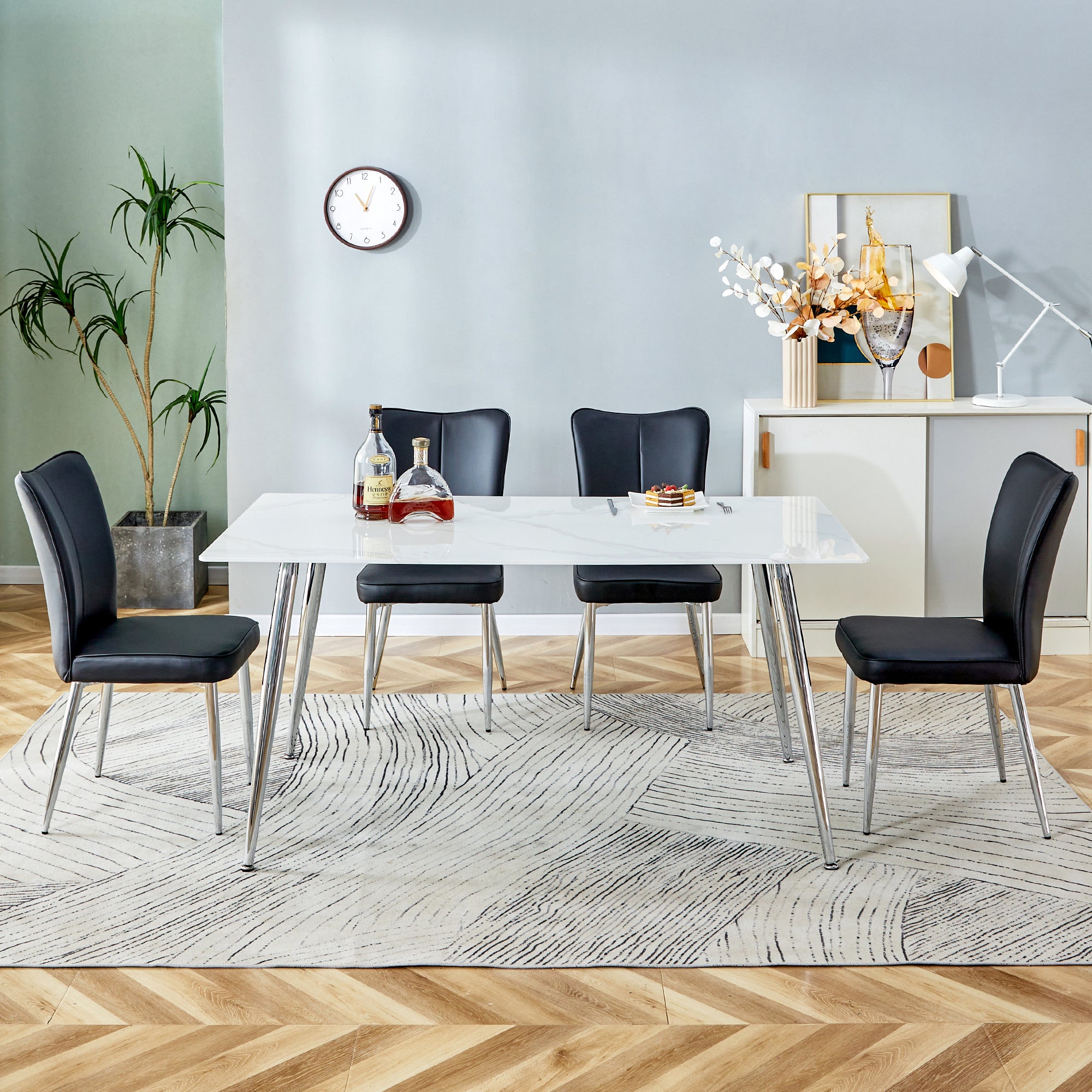 Table and chair set. 1 table with 4 black PU chairs.Rectangular dining table with white imitation marble tabletop and silver metal legs.Paired with 4 chairs with silver legs.DT-1544 C-008