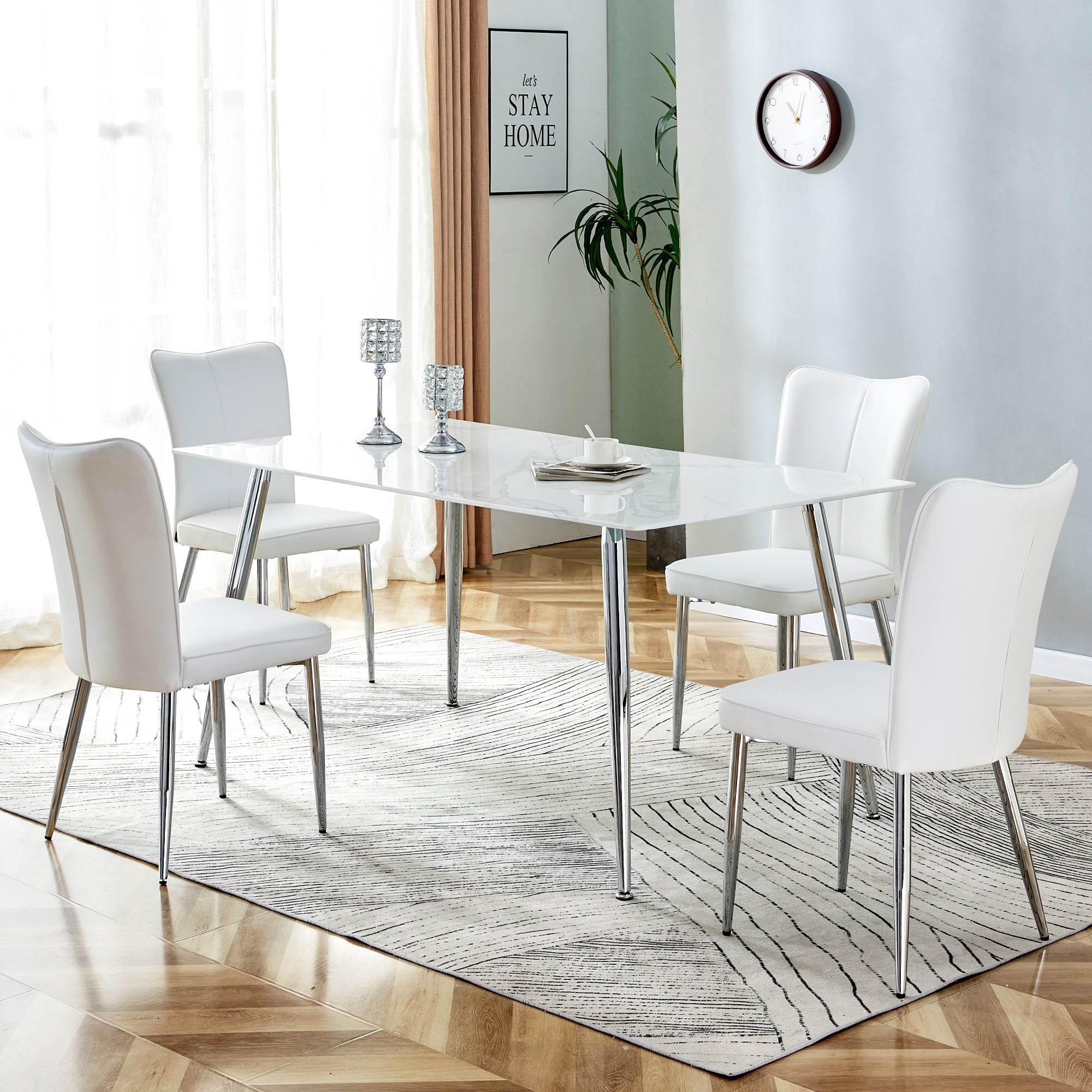 Table and chair set. 1 table with 4 white PU chairs.Rectangular dining table with white imitation marble tabletop and silver metal legs.Paired with 4 chairs with silver legs.DT-1544 C-008