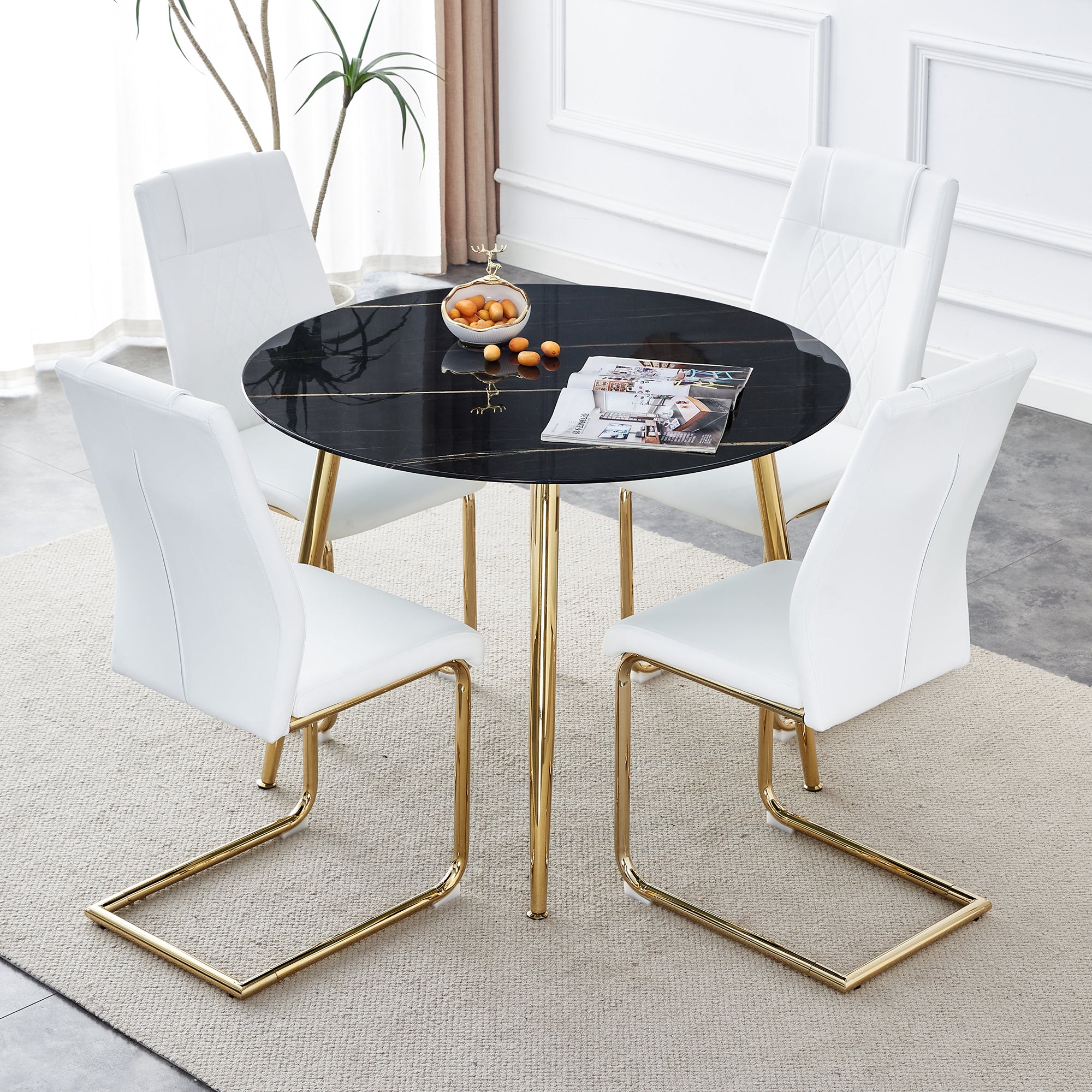 1 table and 4 chairs, a modern minimalist circular dining table with a 40 inch black imitation marble tabletop and gold-plated metal legs, and 4 modern gold-plated metal leg chairs.