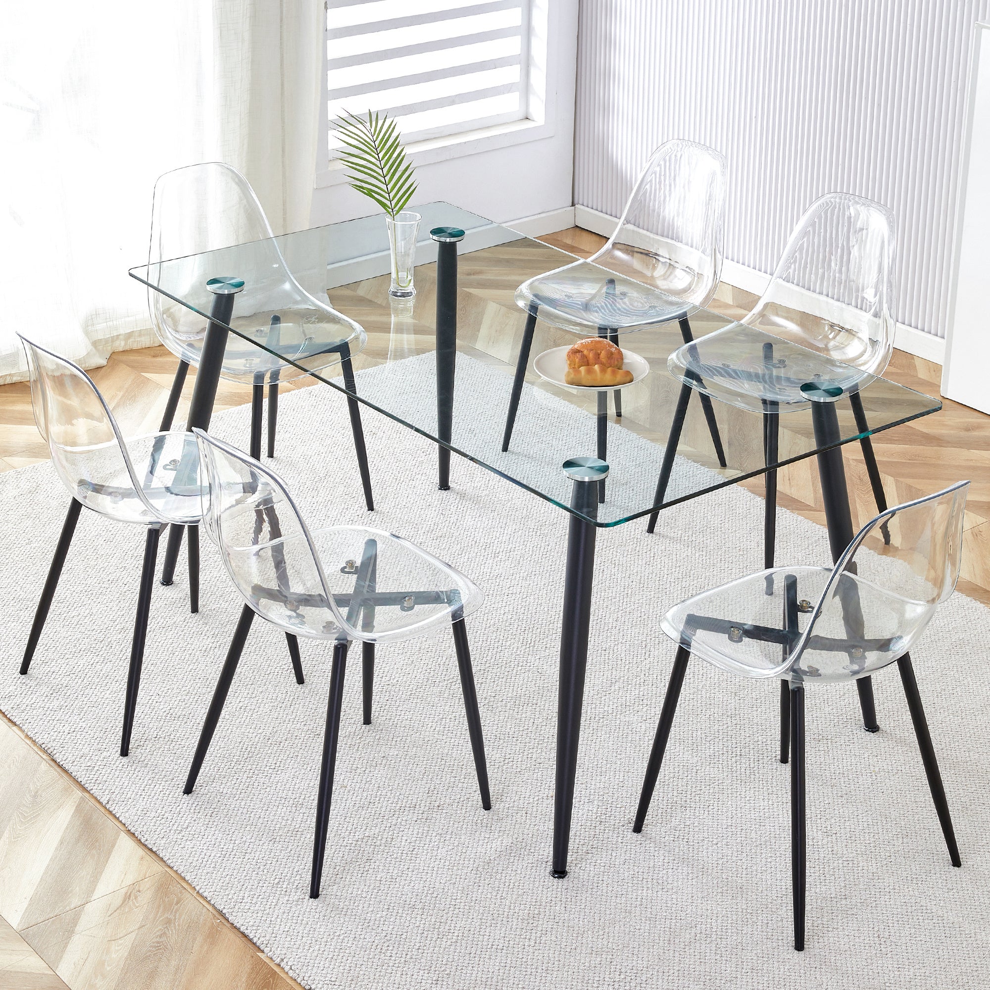 1 table and 6 chairs. Rectangular table, transparent tempered glass tabletop, and black metal table legs. Paired with 6 black metal leg chairs. DT-1544 TW-1200