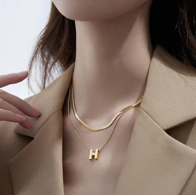 French light luxury design snake bone chain letter H double layer titanium steel necklace female temperament collarbone sweater chain wholesale