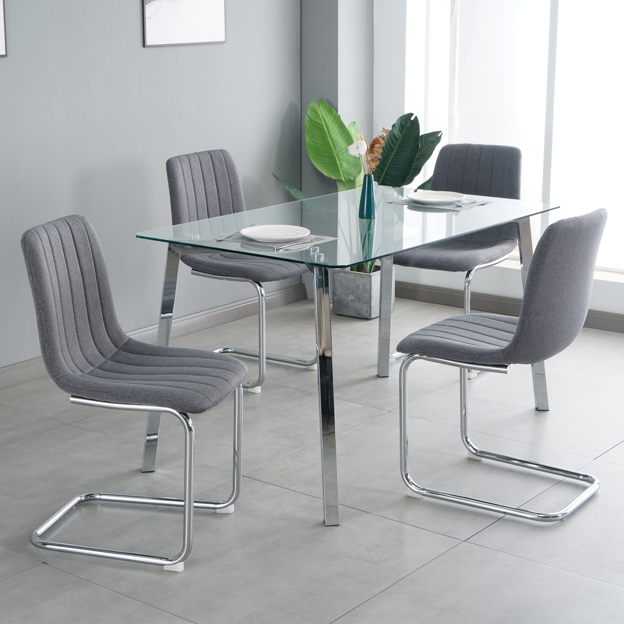 63 " Table and chair set, one table and four chairs. Clear tempered glass table top, 0.3" thick, silver metal legs. fabric chair with electroplated metal legs.