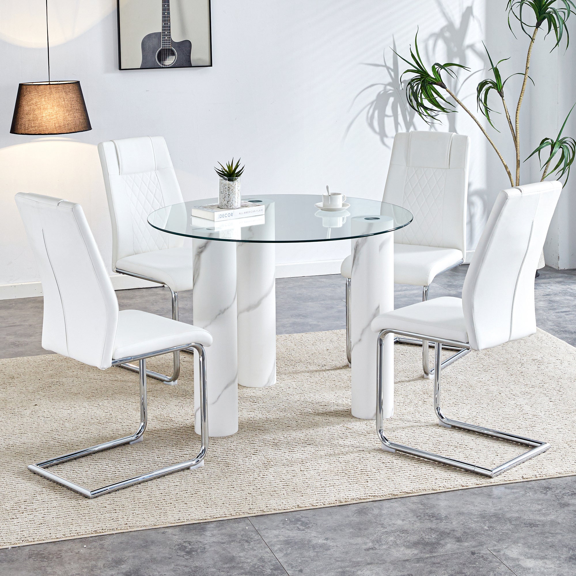 A modern minimalist circular dining table suitable for 6-8 people,Paired with 4 PU leather cushioned dining chairs with silver metal legs. F-X03 C-001