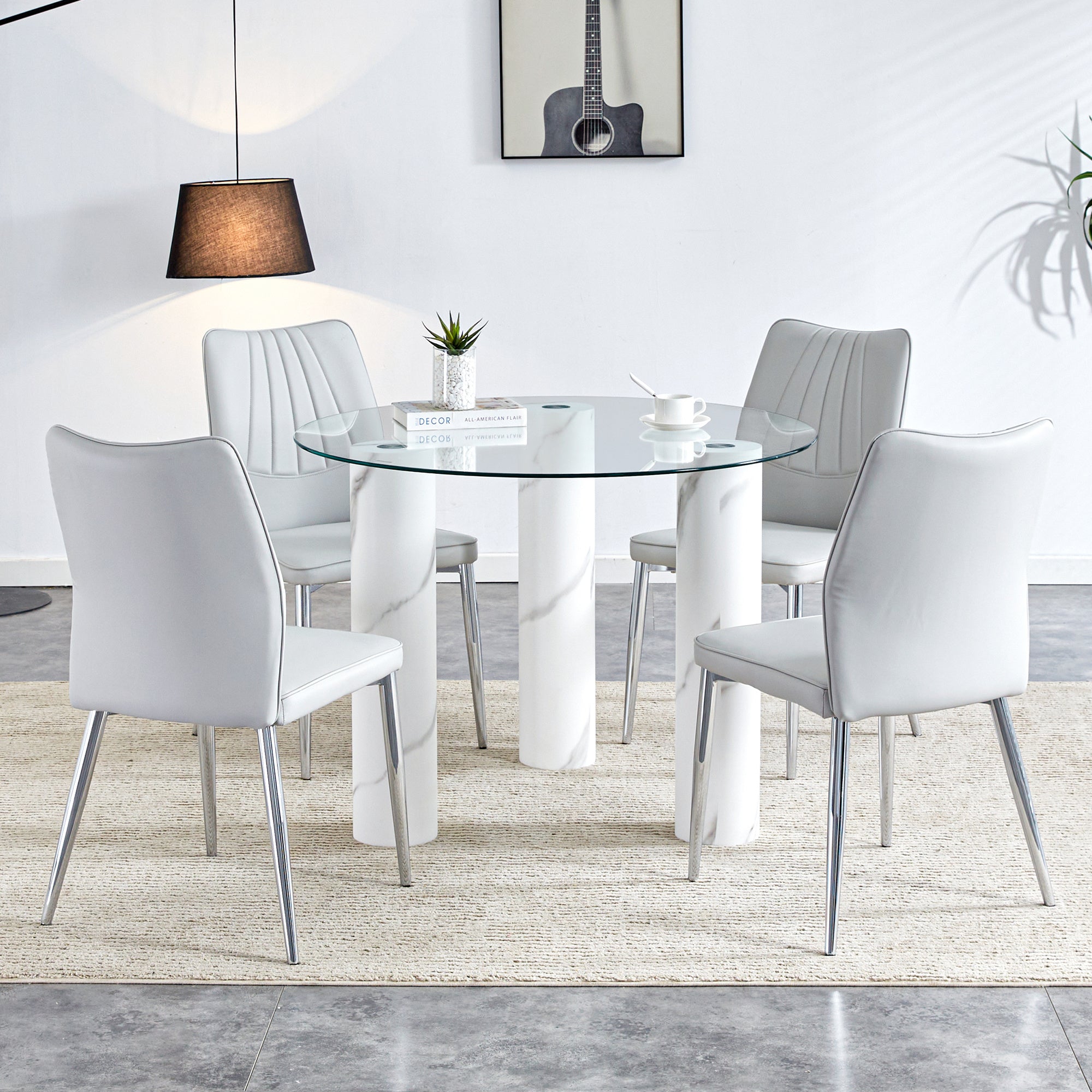 A modern minimalist circular dining table suitable for 6-8 people, a set of 4-piece PU leather backrest and silver metal legs modern dining chairs. F-X03 C-009